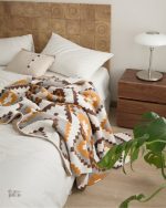 Plaid pilou pilou, parfait pour les soirées cocooning