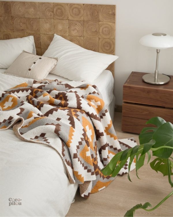 Plaid pilou pilou, parfait pour les soirées cocooning