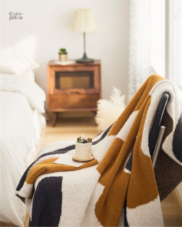Plaid en fausse fourrure pour un intérieur cosy