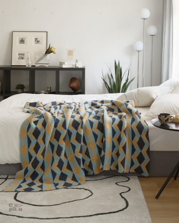 Plaid en duvet, idéal pour les soirées cocooning