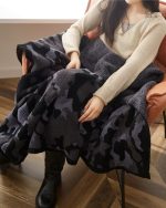 Couverture en pilou pilou noir, idéale pour l'hiver
