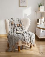 Couverture pilou pilou grise, parfaite pour les soirées cocooning