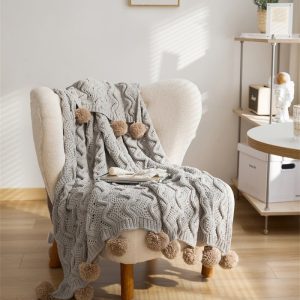 Couverture pilou pilou grise, parfaite pour les soirées cocooning