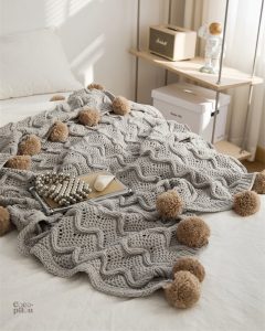 Plaid moelleux gris, idéal pour se blottir au coin du feu