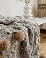 Plaid chaud en gris, parfait pour les nuits d'hiver
