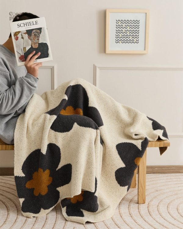 Couverture douce en pilou pilou, parfaite pour le cocooning