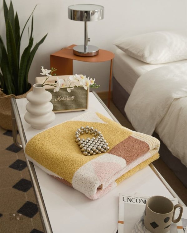 Plaid confortable en sherpa, accessoire essentiel pour l'hiver