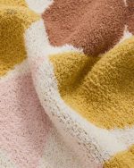 Couverture cosy en sherpa, idéale pour les moments de détente