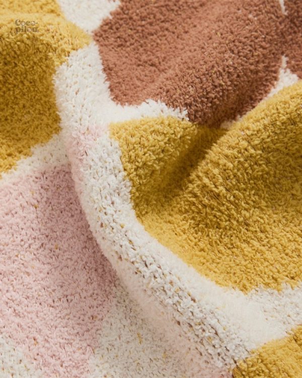Couverture cosy en sherpa, idéale pour les moments de détente